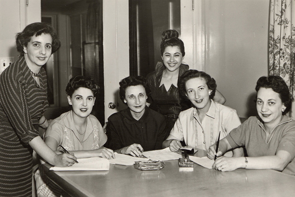 A group of women working at a table at Vancouver Talmud Torah, Vancouver, B.C., 1955. 